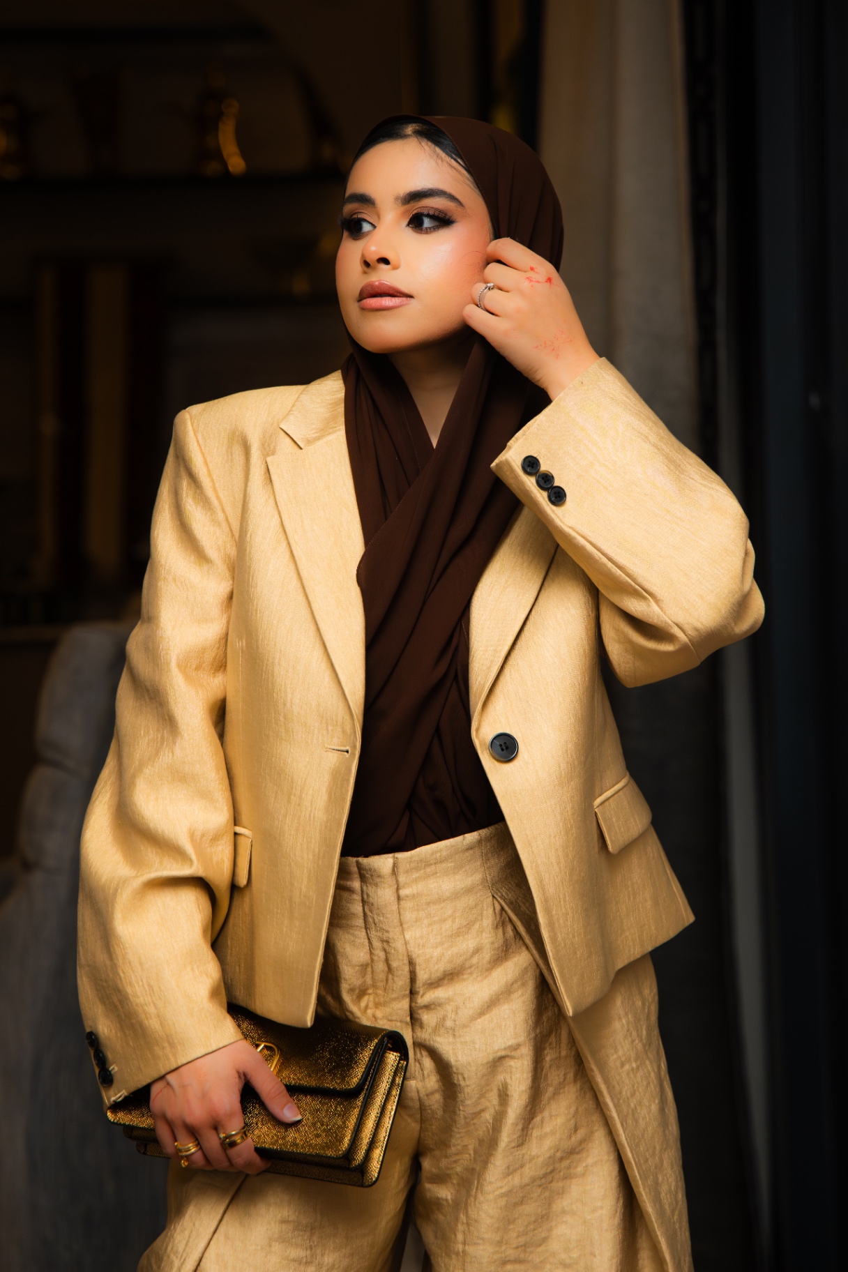 Gold blazer and hijab portrait