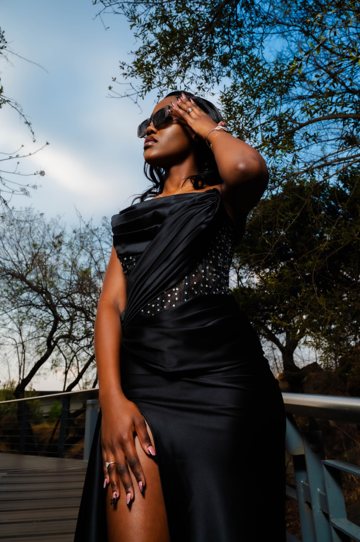 Black evening gown on bridge